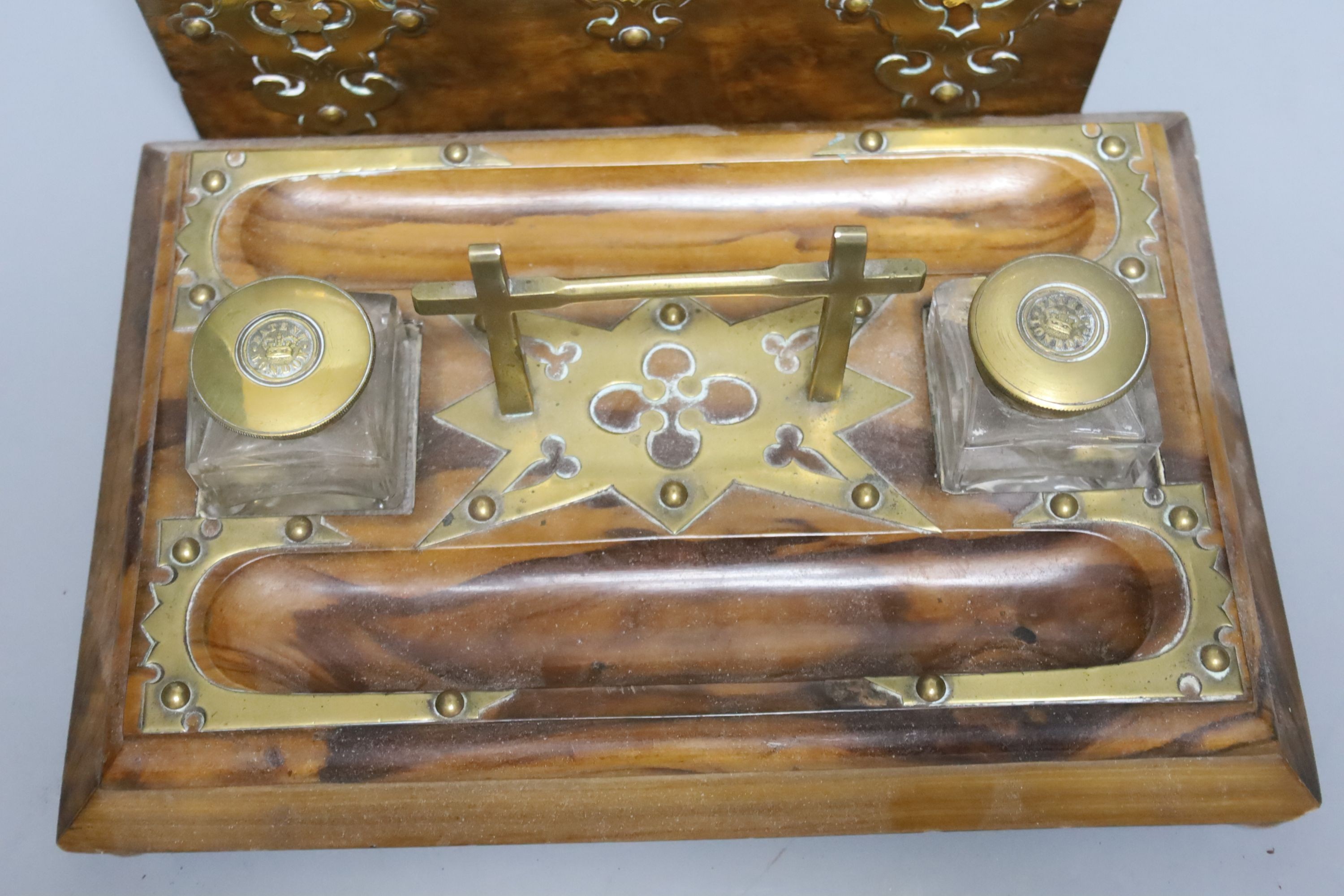 A 19th century domed brass mounted tea caddy, 23 x 18cm and a two bottled ink stand